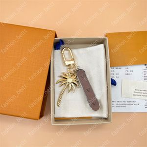 Porte-clés de voiture de styliste pour hommes et femmes, pendentif de luxe en forme de cocotier, avec boucle en or classique, ornement de sac