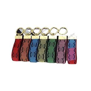 Porte-clés de créateur de mode de luxe à la main en cuir PU voiture porte-clés femmes sac pendentif à breloque accessoires