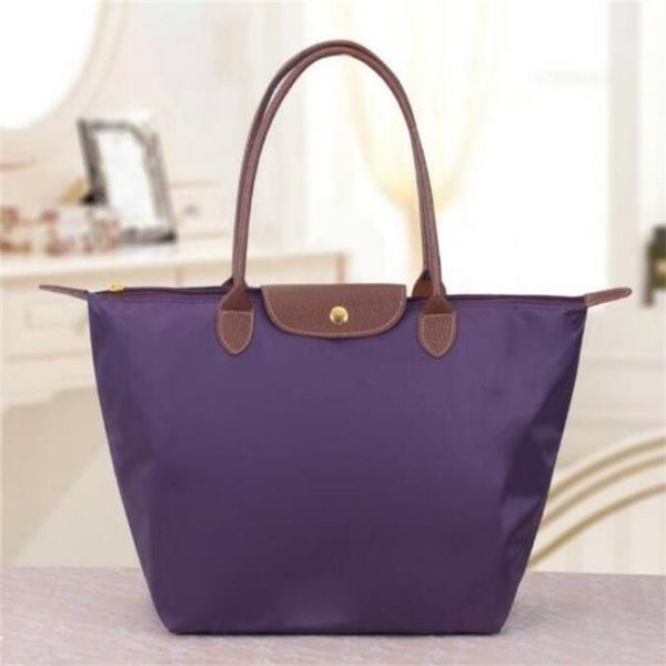 Bolsos de noche de lujo de moda Diseñador Mujer Bolsos de hombro casuales Bolso de bola de masa de nailon impermeable Bolso de mano de gran capacidad Bolso de mamá Bolso de playa de compras plegable