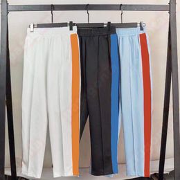 Nuevos pantalones informales para hombre, pantalones de chándal elásticos a rayas multicolor a la moda, ropa de calle para hombre y mujer, pantalones con correas