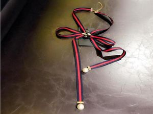Mode Nieuwe Europese en Amerikaanse college Wind Stripe Ribbon Bow Bee Pearl ketting Halsketting BHOOCH BOOK BOUG Tie Multius X57616881
