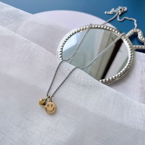 Collier de chaîne en argent de mode en acier inoxydable plaqué or en forme de coeur smiley visage pendentif collier léger luxe femmes bijoux accessoires J12193