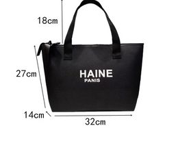 Mode Simple épaule grande capacité sac cosmétique portable shopping mode linge de bureau couleur unie maman sac à main en gros