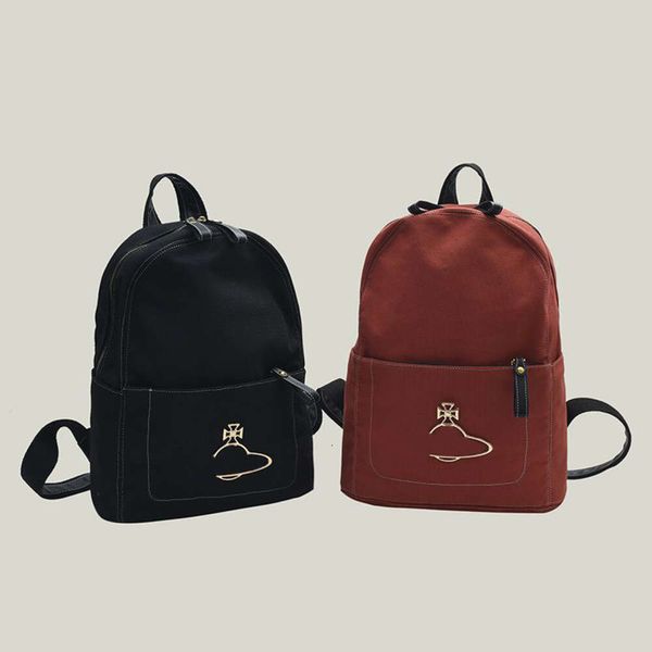 Moda Solid Color Designer Mochila lienzo Saturno Appliques Bolso de la escuela Bolso de hombro Gran capacidad bolsas