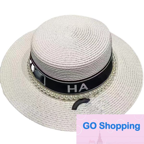 Sombrero de paja de moda Verano Nueva Perla de agua Marca de letra Sombrero de copa plana de ala grande Sombreros de sol de playa al por mayor