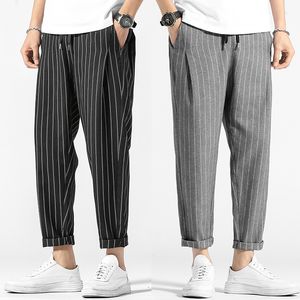 Fashion Stripe Plaid Pantalon Mens Automne Japonais rétro Men décontracté streetwear lâche cordon de craquille sauvage pantalon mâle 220509