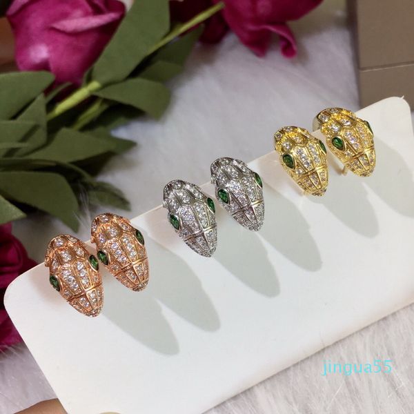 Style de mode dame femme laiton 18 carats plaqué or plié complet diamant vert yeux serpent tête boucles d'oreilles gouje oreilles clip