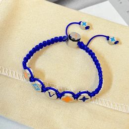 Estilo de moda Hombres Mujeres Joyería Naranja Bule Pulsera tejida Hardware de plata Esmalte Cuentas de flores Cuerda de nylon Pulseras con dijes coloridos Brazalete de hombres