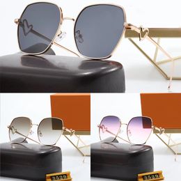 Gafas de sol de moda Diseño clásico Ciclismo de lujo para hombres Mujeres Piloto Gafas de sol UV400 Gafas Marco de metal con caja Amor