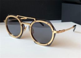 Gafas de sol de moda marco de metal redondo lente poligonal diseño único estilo popular al aire libre uv400 gafas protectoras de calidad superior