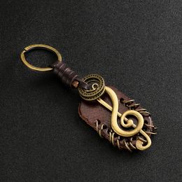 Mode vintage marron authentique en cuir aile boussole symbole de musique keychain charme accessoires en alliage