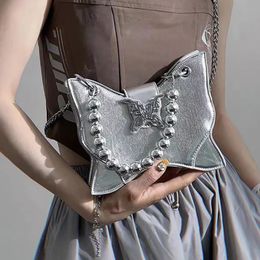 Fashion Womens Butterfly Handbag Womens Punk Street Vêtements Metal Buckle Pearl Handbag 240510