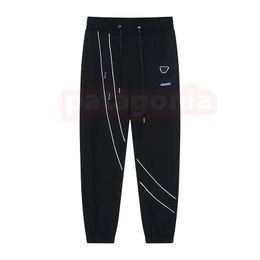 Mode Femmes Pantalons décontractés Hommes Impression Harem Joggers Couples Pantalon noir lâche Taille asiatique M-2XL