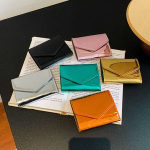 Mode Dames Korte Portefeuilles Eenvoudige Mode Kaarthouder Portemonnee PU Leer Laser Helder Oppervlak Drievoudige Portemonnee Mini Clutch Bag