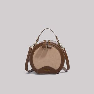 Bolso redondo pequeño de moda y de alta gama, nuevo bolso redondo para pastel de otoño e invierno para mujer, bolso cruzado de un solo hombro moderno y versátil