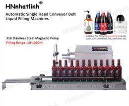 Máquinas de llenado Máquina de llenado de líquidos con bomba magnética de muestra de perfume esencial automática pequeña con transportador alrededor de 20-30 botellas/min C-600