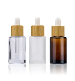 Botellas de perfume de aceite esencial de vidrio de hombro plano Botella de cuentagotas transparente de ámbar esmerilado 30 ml 1 oz con tapa de bambú 5917033