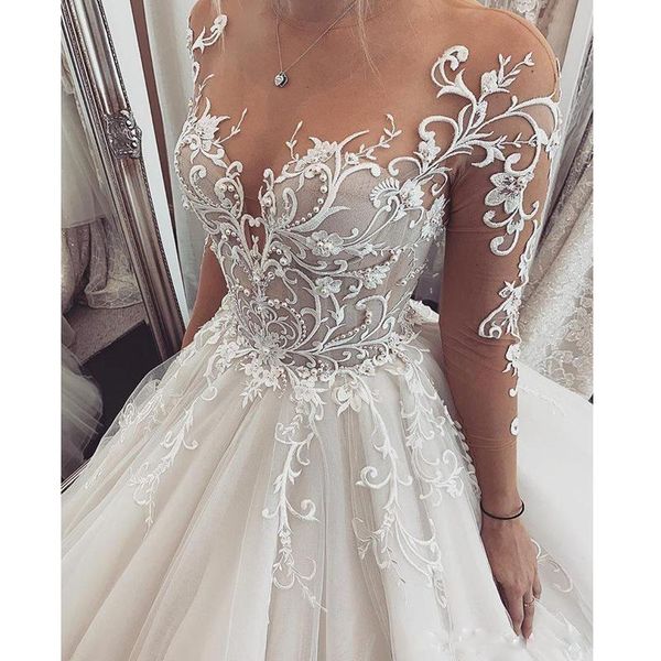 Apliques de encaje floral Línea A Vestidos de novia Perlas Con cuentas Capilla Tren Tul Vestidos de novia Ilusión Mangas largas Escote corazón transparente 2023 Vestido