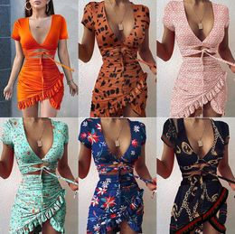 Floral Print Fashion Tie Up Wrap Mini Dress 2021 Summer Holiday Ruffles Robe d'été Ruched Robes décontractées pour femmes Manches courtes S-3XL 051901