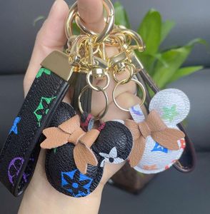 Porte-clés de voiture en métal imprimé de lettres de fleurs, pendentif de sac, breloque, porte-clés pour femmes et hommes, mode en cuir PU, accessoires de porte-clés animaux