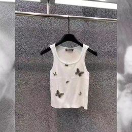 Elegancia de aleteo: chaleco de manchas de metal de mariposa para mujeres, camiseta sin mangas sin mangas de la tripulación, camisetas de diseñador, camiseta de punto informal de verano