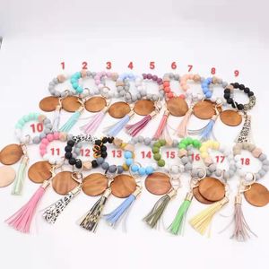 oreign Trade Food Grade Silicone Perle Bracelet Porte-clés En Cuir PU Gland Pendentif Porte-clés En Gros Femmes Multi Couleur En Option