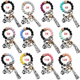 Buitenlandse handel voedselkwaliteit Siliconen Pols Pols Key Chain Pu Leather Tassels Creatieve snijkoeien Key Ring Groothandel Multi-kleuren opties voor vrouwen