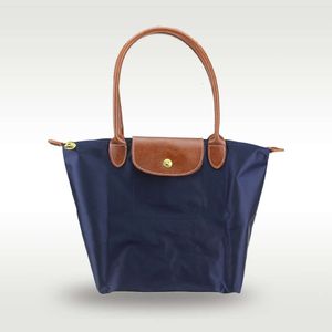 Classique français grande poignée longue poignée portable sac à un épaule sac fourre-tout femme longxiang sacs