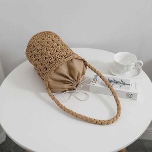Franse stro geweven tas voor dames s nieuwe niche uitgehold bucket vakantie strand 240312
