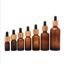 Flacon compte-gouttes en verre ambré givré 5ml 10ml 15ml 20lm 30ml 50ml 100ml avec bouchon en bambou 1oz bouteilles d'huile essentielle en bois Rtikv