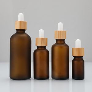 Flacon compte-gouttes en verre brun givré avec couvercle en bambou bouteilles d'huile essentielle de cheveux de cuticule cosmétiques