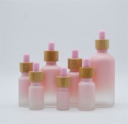 Flacon compte-gouttes en verre dépoli Pipette goutte à goutte couleur rose avec bouchon en bambou 1 oz bouteille d'huile essentielle 5 ml 10 ml 20 ml 30 ml 50 ml 100 ml caisse d'emballage JL1576