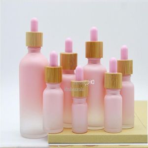 Flacon compte-gouttes en verre dépoli Pipette goutte à goutte couleur rose avec bouchon en bambou bouteille d'huile essentielle de 1 oz 5 ml 10 ml 20 ml 30 ml 50 ml 100 ml emballage Cas Frjv