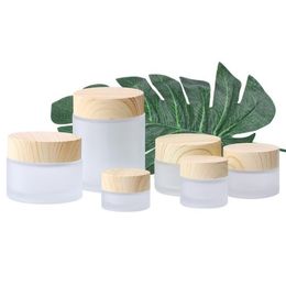 Bouteilles de crème en verre givré Pots cosmétiques ronds Bouteille de crème pour le visage avec bouchon en grain de bois 5g 10g 15g 30g 50g 100g Bouteilles d'emballage