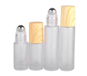 Bouteilles à rouleaux en verre dépoli 5ml 10ml Roll on Bottle avec des couvercles en plastique à grain de bois en métal pour les baumes à lèvres à l'huile essentielle de parfum SN388