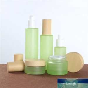 Bouteille en verre vert givré Pot de crème Lotion de pulvérisation Bouteilles de pompe Récipient cosmétique avec couvercles en bois imités