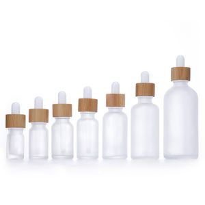 Botella cuentagotas de vidrio blanco esmerilado 10ml 15ml 20ml 30ml 50ml con tapa de bambú Botellas de aceite esencial de madera de 1 oz