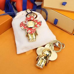 Diseño divertido bolso encantos diseñador de lujo parejas llavero Nuevo Girasol Llavero Colgante Lindo Panda titular de la clave Accesorios de moda para mujeres hombres