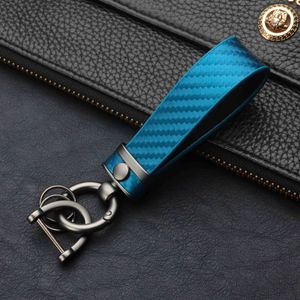 Porte-clés de voiture en cuir véritable universel robuste porte-clés porte-clés porte-chaîne en Fiber de carbone motif édition de mode