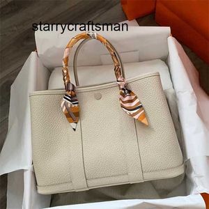 Sac de jardin en cuir véritable 2023 Mode en cuir véritable femme grande capacité seau une épaule portable mariage de mariée L avec logo