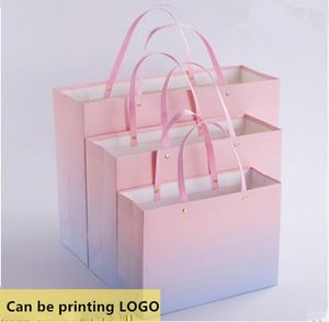 Emballage cadeau 100 PCS/LOT Style de haute qualité sac en papier Rivet poignée emballage Shopping peut taille personnalisée