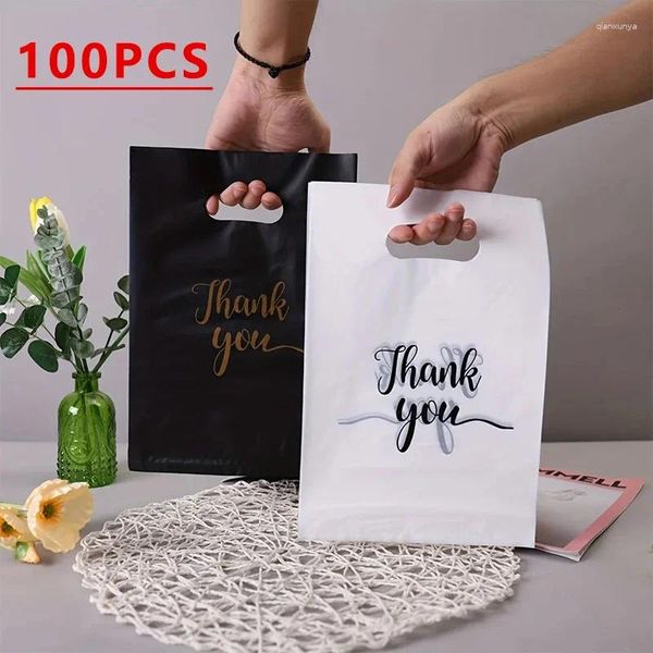 Enveloppe-cadeau 100pcs merci sac plastique à main d'estampage à la main Impression d'anniversaire de fête de fête de biscuit de bonbons