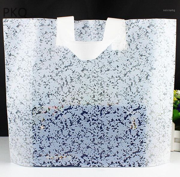 Cadeau cadeau 100pcs en gros en plastique présent sac blanc emballage avec poignée bijoux / boutique pack sacs à provisions fête de Noël1