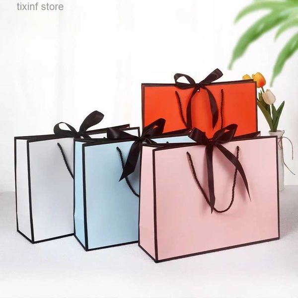 Cadeau Wrap 10pcs / lot de haute qualité joli sac cadeau rose boîte-cadeau ornement pyjama livre poignée noire avec ruban boîte en papier sac emballage kraft T240309