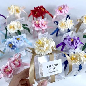 Cadeau cadeau 20 / 50pcs boîte de bonbons de mariage en PVC transparent avec des souvenirs de ruban de fleurs artificielles pour les invités mat dragées chocolat