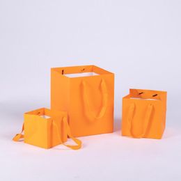 Geschenkwikkeling Orange 3Sken 12x12x12cm/16x16x16cm/20x20x25cm zakken met handgrepen Paper Party Gunst Bag Huidige verpakkingskoffers Containers