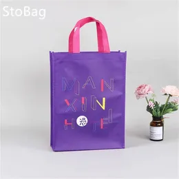 Cadeau cadeau Stobag violet non-tissé sac imperméable épaissi emballage vêtements snack bonbons livre pour bébé douche fête d'anniversaire décor