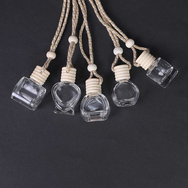 Botellas de perfume vacías de vidrio Decoraciones para automóviles Diseños múltiples Clips de ventilación Adorno colgante Difusor de aceites esenciales Ambientador Fragancia DIY con tapas triangulares de madera