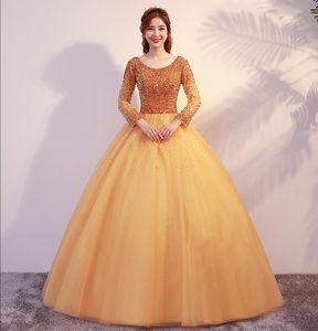 Gouden baljurk prinses bescheiden prom jurken met lange mouwen kralen top lace-up achtervloer lengte meisjes bescheiden feestjurken Custom