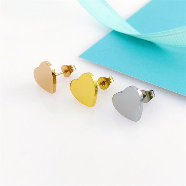 Pendientes de oro Pendientes de lujo Pendientes de diseño Pendientes de diamantes Pendientes de acero de titanio en forma de corazón Pendientes de compromiso de mujer de alta calidad con bolsa